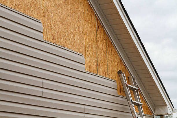 Professional Storm Damage Siding Repair technician working in Kent, OH